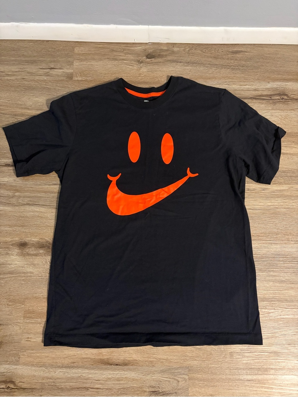 Nike Black Short Sleeve Tee with Orange Smiley Swoosh